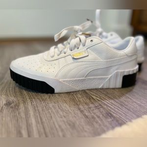White and black Puma women’s shoes